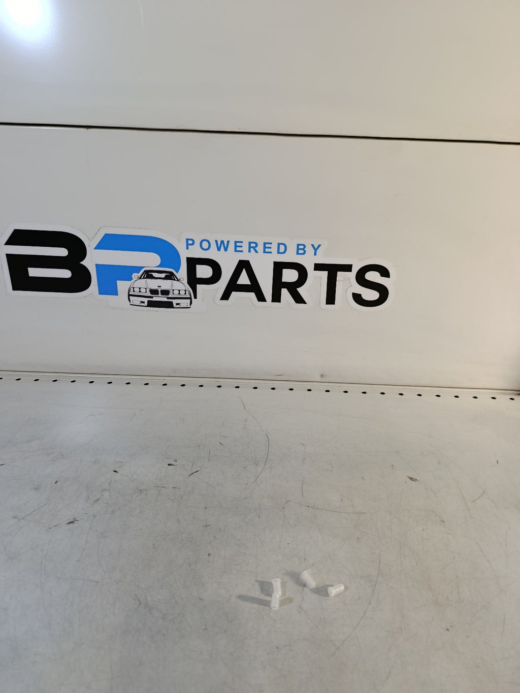 One New Genuine Emblem Grommet Rear 51148209932 for BMW e65